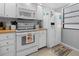 A well-equipped kitchen with white appliances and ample storage space at 1551 Beach Rd # 207, Englewood, FL 34223