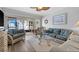 Comfortable living room leads out to a screened in balcony for outdoor living at 1551 Beach Rd # 207, Englewood, FL 34223