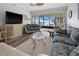 Cozy living room offers beach access and a ceiling fan at 1551 Beach Rd # 207, Englewood, FL 34223