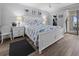 Relax in this main bedroom featuring nautical themed decor and beach access at 1551 Beach Rd # 207, Englewood, FL 34223