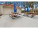 Outdoor picnic area with umbrella-covered tables, ideal for community gatherings at 1551 Beach Rd # 207, Englewood, FL 34223