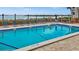 Community pool overlooking the bay, perfect for relaxing and enjoying the waterfront views at 1551 Beach Rd # 207, Englewood, FL 34223