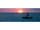 Sunset over the water, boat out on the water at 1551 Beach Rd # 207, Englewood, FL 34223