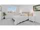 Bright bedroom with plush carpet, white walls, and a large window for ample natural light at 17685 Boracay Ct # 202, Venice, FL 34293