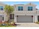 Charming townhome featuring an attached garage, well-maintained landscaping, and inviting front entrance at 17685 Boracay Ct # 202, Venice, FL 34293
