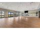Bright yoga studio featuring hardwood floors, large mirrors, and natural light, creating a serene workout space at 17685 Boracay Ct # 202, Venice, FL 34293
