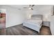Bedroom features laminate wood flooring and bedside tables with lamps at 18 Annapolis Ln, Rotonda West, FL 33947