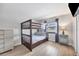 This bedroom features a bunk bed, wood-look floors, and good natural light at 18 Annapolis Ln, Rotonda West, FL 33947