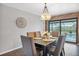 Charming dining room with wood-look flooring and decorative wall art at 18 Annapolis Ln, Rotonda West, FL 33947
