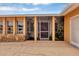 Covered entryway with stone accents and well-lit with a transom at 18 Annapolis Ln, Rotonda West, FL 33947