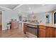 Kitchen island with stainless steel stove overlooks the breakfast nook with dining table and seating for six at 18 Annapolis Ln, Rotonda West, FL 33947