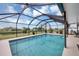 Enjoy swimming in this screened pool, featuring serene surroundings for ultimate relaxation and privacy at 18 Annapolis Ln, Rotonda West, FL 33947