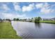 An expansive view of the waterfront and canal, showcasing the neighborhood homes and landscaping at 18 Annapolis Ln, Rotonda West, FL 33947