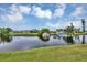A lovely waterfront view showcasing the canal, boat, and backyard of the property at 18 Annapolis Ln, Rotonda West, FL 33947
