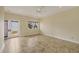 Spacious bonus room with tile floors, a ceiling fan and a view of the water at 1905 Mississippi Ave, Englewood, FL 34224