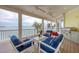 Relaxing screened-in patio with comfortable seating and stunning waterfront views at 1905 Mississippi Ave, Englewood, FL 34224