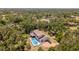 Aerial photo showing the home's pool, outdoor area, and surrounding greenery at 2020 E Dolphin Dr, Englewood, FL 34223