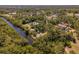Beautiful aerial view of a home, river, and lush surroundings at 2020 E Dolphin Dr, Englewood, FL 34223