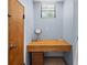 Bathroom vanity nook with wood table and rattan basket at 2020 E Dolphin Dr, Englewood, FL 34223