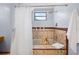 Bathroom featuring a shower/tub with decorative tiling, and rainfall shower head at 2020 E Dolphin Dr, Englewood, FL 34223