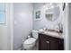Bathroom with vanity, toilet, mirror, and neutral colors at 2020 E Dolphin Dr, Englewood, FL 34223