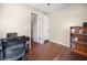 Bedroom with wood floors, neutral walls, and closet space at 2020 E Dolphin Dr, Englewood, FL 34223