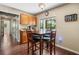 Breakfast nook with wood floors, wood table and chairs, and natural light at 2020 E Dolphin Dr, Englewood, FL 34223