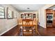 Inviting dining area featuring a wooden table, six chairs, and stylish decor, ideal for gatherings at 2020 E Dolphin Dr, Englewood, FL 34223