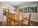 Bright dining room with a wooden table and seating for six, perfect for Gathering meals and gatherings at 2020 E Dolphin Dr, Englewood, FL 34223