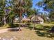 Charming home with palm trees, lush landscaping, and inviting curb appeal at 2020 E Dolphin Dr, Englewood, FL 34223