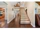 Open foyer with hardwood floors, staircase, and access to multiple rooms at 2020 E Dolphin Dr, Englewood, FL 34223