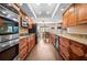 Modern kitchen with stainless steel appliances, granite countertops, and ample cabinet space for storage at 2020 E Dolphin Dr, Englewood, FL 34223