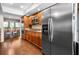 Spacious kitchen features stainless steel appliances, wood cabinets, and breakfast nook beyond at 2020 E Dolphin Dr, Englewood, FL 34223