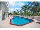 The backyard pool area features a fenced perimeter and ample lounge space at 2020 E Dolphin Dr, Englewood, FL 34223