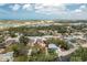 Aerial view of a home in a neighborhood near a lake at 221 Nippino E Trl, Nokomis, FL 34275
