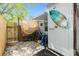 Outdoor shower with a surfboard, bikes, and a fully fenced private backyard at 221 Nippino E Trl, Nokomis, FL 34275