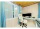 Bright office space with a large window, modern desk, and comfortable chair ideal for remote work at 221 Nippino E Trl, Nokomis, FL 34275
