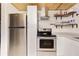 Bright kitchen featuring stainless steel appliances, modern cabinets, and ample storage space at 221 Nippino E Trl, Nokomis, FL 34275