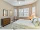 Bright bedroom with plantation shutters and neutral decor at 24181 Gallberry Dr, Venice, FL 34293