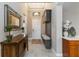 Inviting foyer with a coat rack and bench, and stylish tile flooring at 24181 Gallberry Dr, Venice, FL 34293