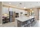 Gourmet kitchen with a large island, stainless steel appliances, and dedicated workspace at 24181 Gallberry Dr, Venice, FL 34293
