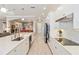 Spacious kitchen featuring a large island, stainless appliances, and seamless integration with adjacent living spaces at 24181 Gallberry Dr, Venice, FL 34293