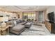 Open-concept living room and kitchen area with a large island and plenty of seating at 24181 Gallberry Dr, Venice, FL 34293