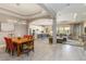 Open-concept kitchen, dining and living area with a large island, dining table and comfortable seating at 24181 Gallberry Dr, Venice, FL 34293