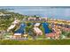 An aerial view of waterfront condos, complete with boat docks, and featuring beautiful bay views at 25188 Marion Ave # D308, Punta Gorda, FL 33950