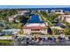 Aerial view of the condo complex with boat docks, waterway access, swimming pool, and tennis courts at 25188 Marion Ave # D308, Punta Gorda, FL 33950