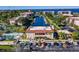 Scenic aerial view of community with a pool, tennis court, canal access, and ample parking at 25188 Marion Ave # D308, Punta Gorda, FL 33950