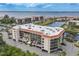 An aerial view of a multi-story building with balconies and stunning water views at 25188 Marion Ave # D308, Punta Gorda, FL 33950