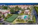 Beautiful community featuring a pool, tennis court, marina, and residences overlooking a scenic bay at 25188 Marion Ave # D308, Punta Gorda, FL 33950