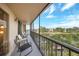 Long screened balcony provides views, seating, and a ceiling fan at 25188 Marion Ave # D308, Punta Gorda, FL 33950